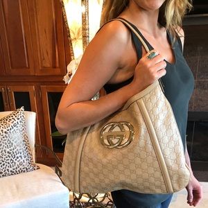Gucci embossed leather purse- NWOT